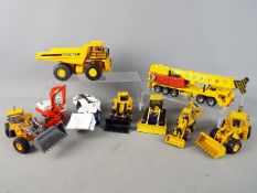 Joal, Conrad, NZG, Hongwell, Siku - Nine unboxed diecast construction vehicles mainly 1:50 scale.