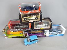 Maisto, New Ray, Bburago - Eight diecast model cars mainly in 1:24 scales and predominately boxed.