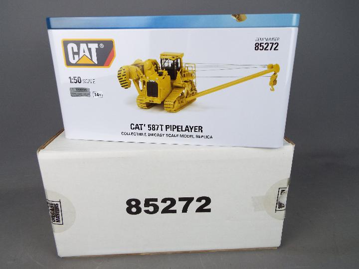 Diecast Masters - A boxed 1:50 scale #85272 Cat 587T Pipelayer by Diecast Masters.