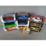 Maisto, Welly, Motor Max, Rastar,Jada - Ten boxed diecast model vehicles in various scales.