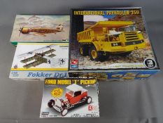 Lindberg, Eduard, AMT - Four boxed plastic model kits in various scales.