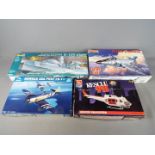 Revell, Trumpeter, AMT, Monogram - Four boxed plastic model kits in various scales.