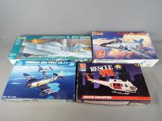 Revell, Trumpeter, AMT, Monogram - Four boxed plastic model kits in various scales.