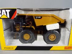 Tonkin Replicas - A boxed 1:50 scale Tonkin Replicas TR30001 diecast Cat MT4400D AC Mining Truck.