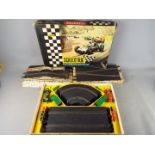 Scalextric - A vintage boxed Scalextric set no. FJ31 with two boxed items of Scalextric Track.