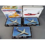 Aoshima - A group of five boxed model kits in various scales.