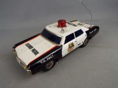 Japanese Tinplate - An unmarked and unboxed Japanese battery operated tinplate Highway Patrol.