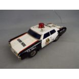 Japanese Tinplate - An unmarked and unboxed Japanese battery operated tinplate Highway Patrol.