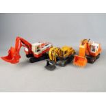 CEF, Shinsei, Diapet - Three unboxed diecast construction Excavators in various scales.