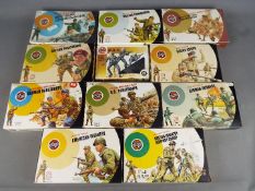 Airfix - A regiment of 11 boxed Airfix 1:32 scale plastic soldiers majority in 'Target' boxes.