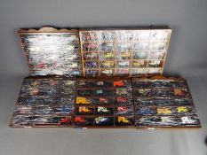 Lledo; Matchbox - Five wall mounted cabinets containing a total of 85 diecast model vehicles.