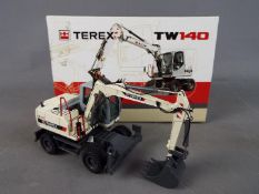 NZG - A boxed diecast 1:50 scale NZG #697 Terex TW140 Mobile Excavator.