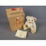 Steiff - the Steiff Millennium Bear, blonde 30 cm (high), button in ear with yellow tag,