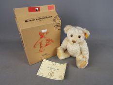 Steiff - the Steiff Millennium Bear, blonde 30 cm (high), button in ear with yellow tag,