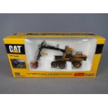 Norscot - A boxed 1:50 scale diecast Norscot #55123 Caterpillar 580B Harvester with HH65 Cutting