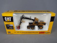 Norscot - A boxed 1:50 scale diecast Norscot #55123 Caterpillar 580B Harvester with HH65 Cutting