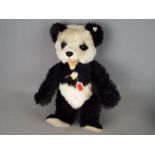 Steiff - an original Steiff Panda Bear, 1951 replica with growler, black and white 48 cm (high),