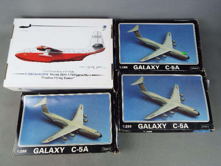 Model plane kits - a collection of four model plane kits to include a Starfix plastic model kit,