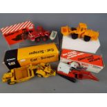 NZG; Conrad, Cursor - Four boxed diecast construction vehicles in 1:50 scale.