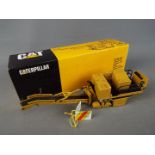 NZG - A boxed NZG 1:50 scale #299 Caterpillar PR-450 Pavement Profiler.