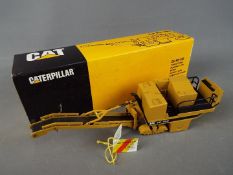 NZG - A boxed NZG 1:50 scale #299 Caterpillar PR-450 Pavement Profiler.