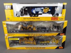 Norscot - Three boxed diecast 1:50 scale trucks by Norscot.