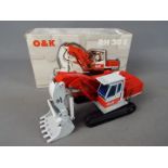 NZG - A boxed diecast 1:50 scale O&K RH30E Excavator by NZG.