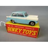 Dinky Toys - A boxed Dinky Toys #189 Triumph Herald The model in two tone white and light blue,