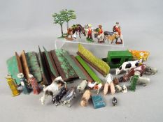 Britains and Similar - A collection of over 30 unboxed metal farm yard figures and accessories by