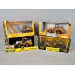 Ertl - A collection of four boxed diecast construction vehicles in 1:50 scale by Ertl.