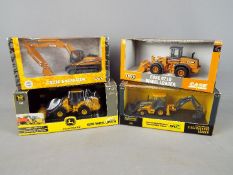 Ertl - A collection of four boxed diecast construction vehicles in 1:50 scale by Ertl.