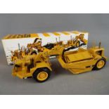 NZG - A boxed diecast 1:50 scale NZG #127 Caterpillar 627 Push-Pull Scraper.