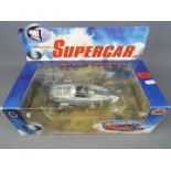 Gerry Anderson - a Gerry Anderson Diecast Classics Supercar in grey by Product Enterprise Ltd,