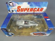 Gerry Anderson - a Gerry Anderson Diecast Classics Supercar in grey by Product Enterprise Ltd,