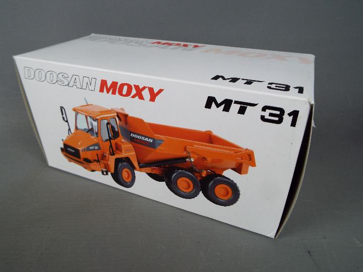 NZG - A boxed diecast 1:50 scale NZG #820 Doosan Moxy MT31 Dump Truck. - Image 4 of 4