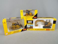 Norscot - A collection of three boxed 1:50 scale diecast construction vehicles by Norscot.