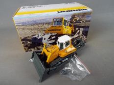 NZG - A boxed diecast 1:50 scale NZG #775 Liebherr PR764 Litronic Crawler Tractor.