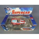 Gerry Anderson - a Gerry Anderson Diecast Classics Supercar in red and blue by Product Enterprise