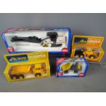 Siku, Volvo - Four boxed diecast 1:50 scale construction vehicles.