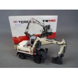 NZG - A boxed diecast 1:50 scale NZG #697 Terex TW140 Mobile Excavator.