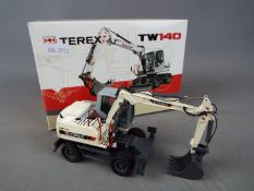 NZG - A boxed diecast 1:50 scale NZG #697 Terex TW140 Mobile Excavator.
