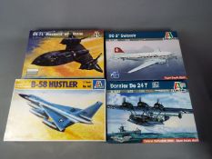 Italeri - a collection of four plastic model kits to include a DC-3 Swissair model No.