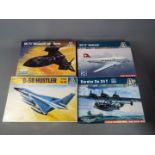 Italeri - a collection of four plastic model kits to include a DC-3 Swissair model No.
