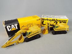 NZG - Two boxed diecast Caterpillar 245 Hydraulic Excavators by NZG. Lot includes #177 and # 160.