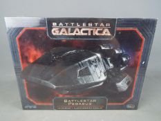 Battlestar Galactica - a 1:4105 scale plastic assembly model kit of Battlestar Pegasus by Moebius