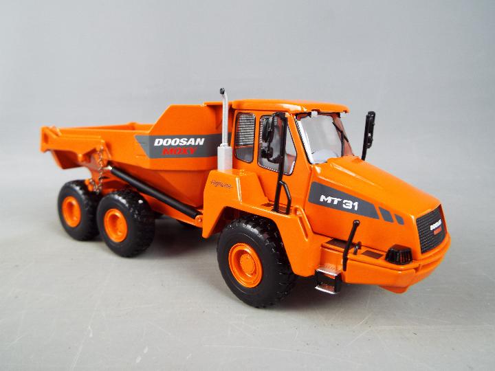 NZG - A boxed diecast 1:50 scale NZG #820 Doosan Moxy MT31 Dump Truck. - Image 3 of 4