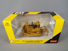 Norscot - A boxed 1:50 scale diecast Norscot #55158 Caterpillar D10T Track Type Tractor.