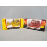 First Gear - Two boxed International diecast model construction vehicles from First Gear.