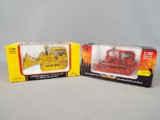 First Gear - Two boxed International diecast model construction vehicles from First Gear.