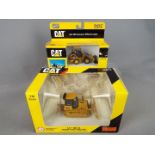 Norscot - Two boxed 1:50 scale diecast Norscot Construction vehicles.